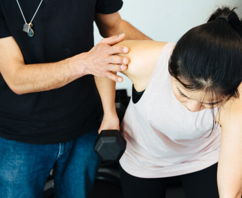 2 person doing exercises rehabilitation