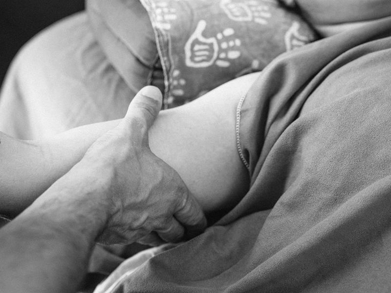 An hand doing MLD for Lipedema on upper arm