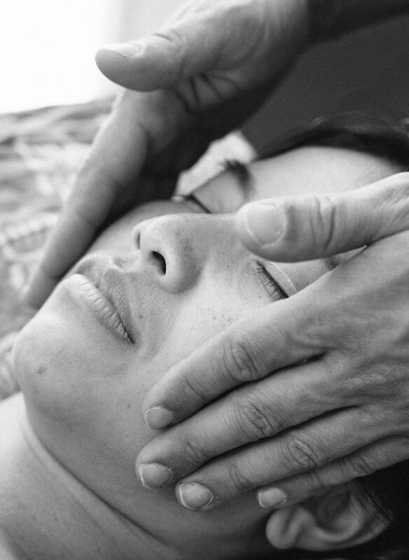 2 hands doing Facial Lymphatic Drainage Massage