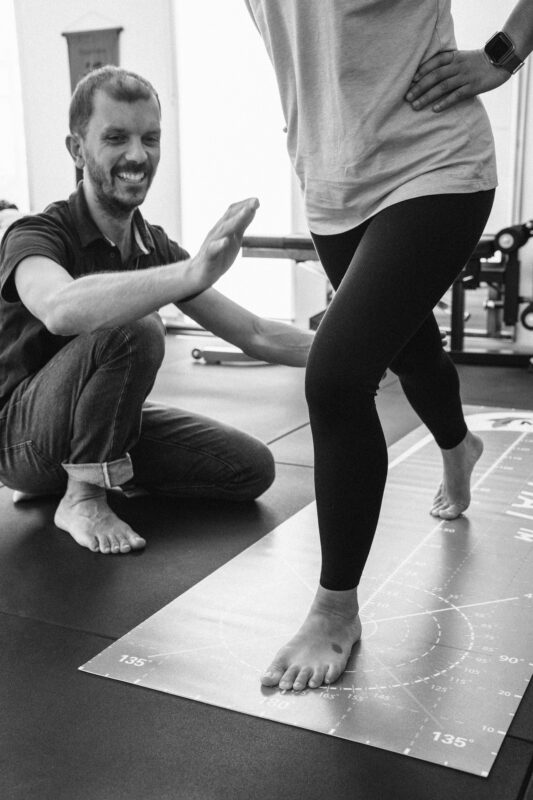 Giovanni doing a mobility/stability test on The Mat